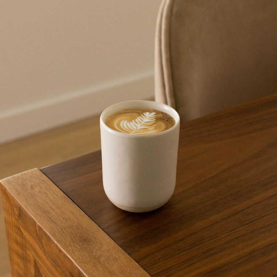 Elegant cappuccino served in classic ceramic cups, perfect for coffee lovers and café enthusiasts