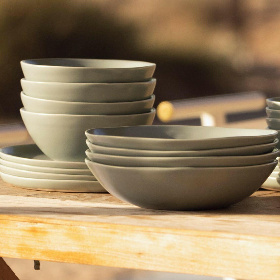 Elegant white porcelain dinnerware set featuring plates and bowls, perfect for formal dining occasions