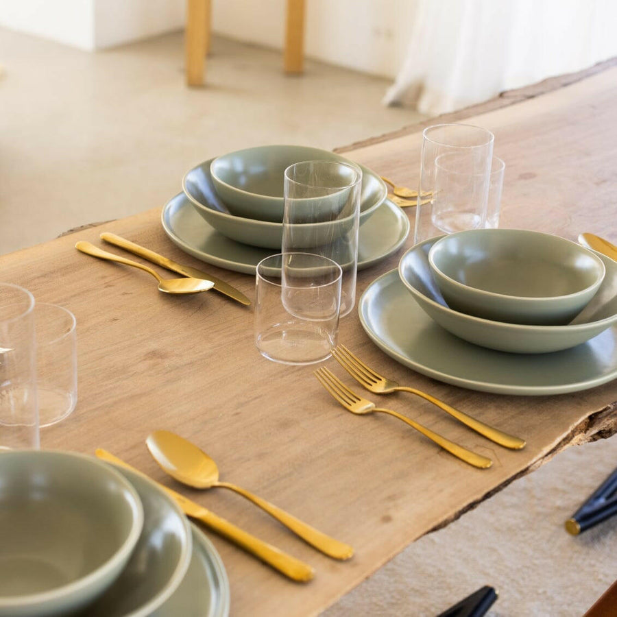 Elegant white porcelain dinnerware set featuring plates and bowls, perfect for formal dining occasions