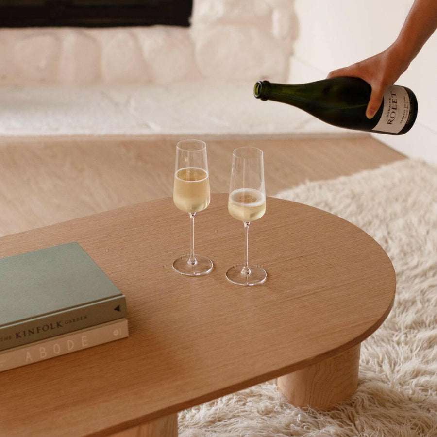 Elegant flute glasses arranged for a formal event, showcasing crystal-clear clarity and refined design
