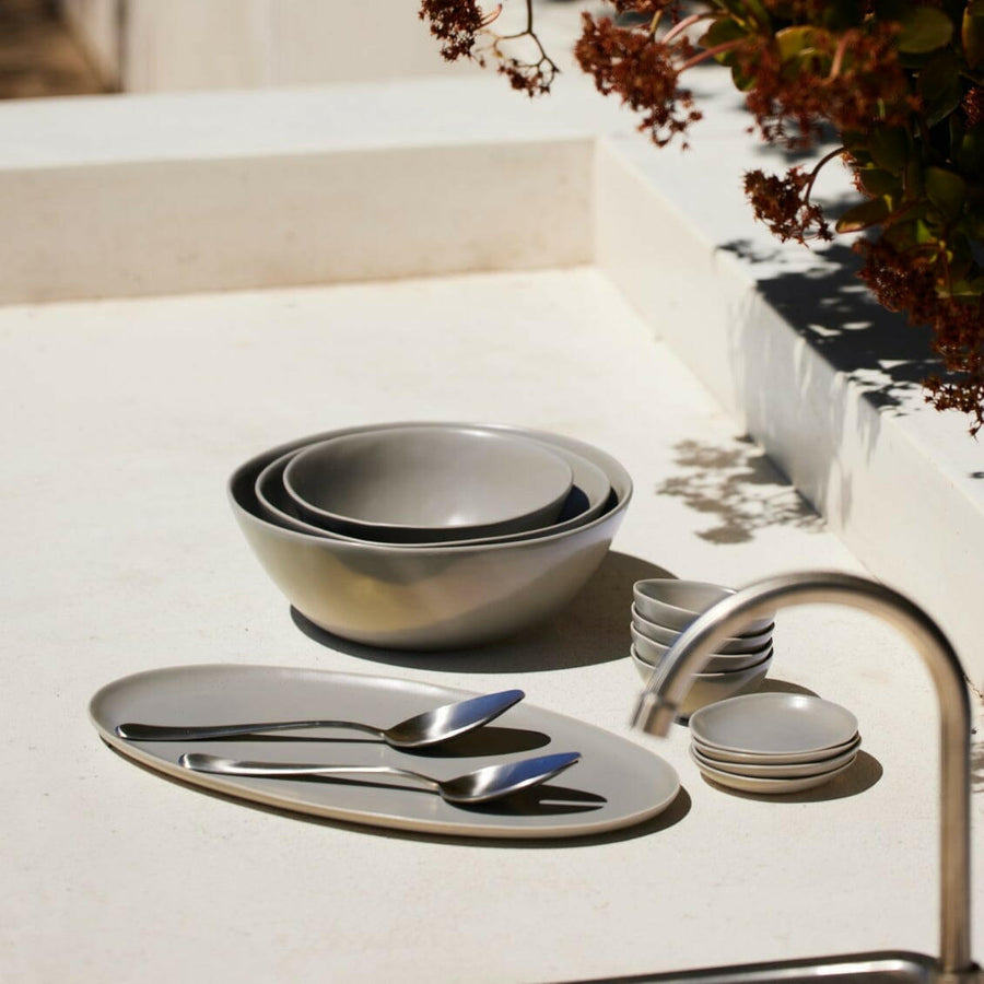 Nested serving trays elegantly arranged, showcasing functionality and style for sophisticated dining experiences.