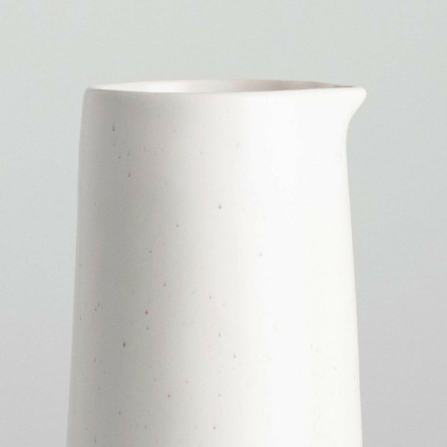 Elegant glass carafe filled with fresh water, perfect for dining table settings and enhancing beverage presentation