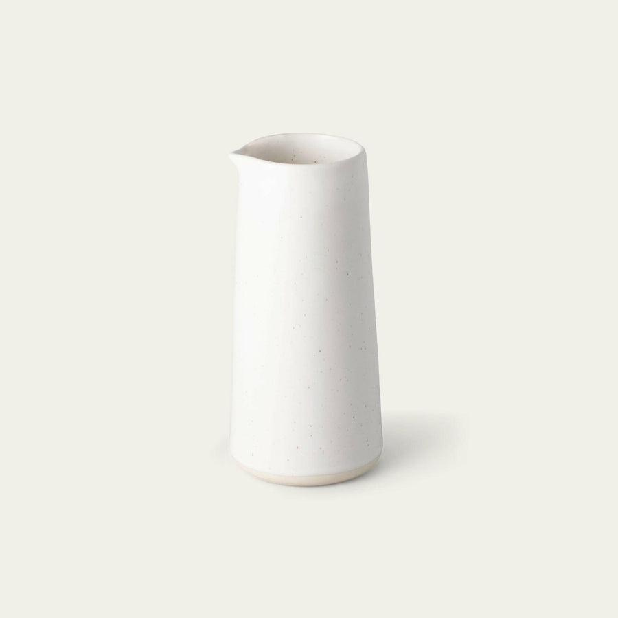 Elegant glass carafe filled with fresh water, perfect for dining table settings and enhancing beverage presentation