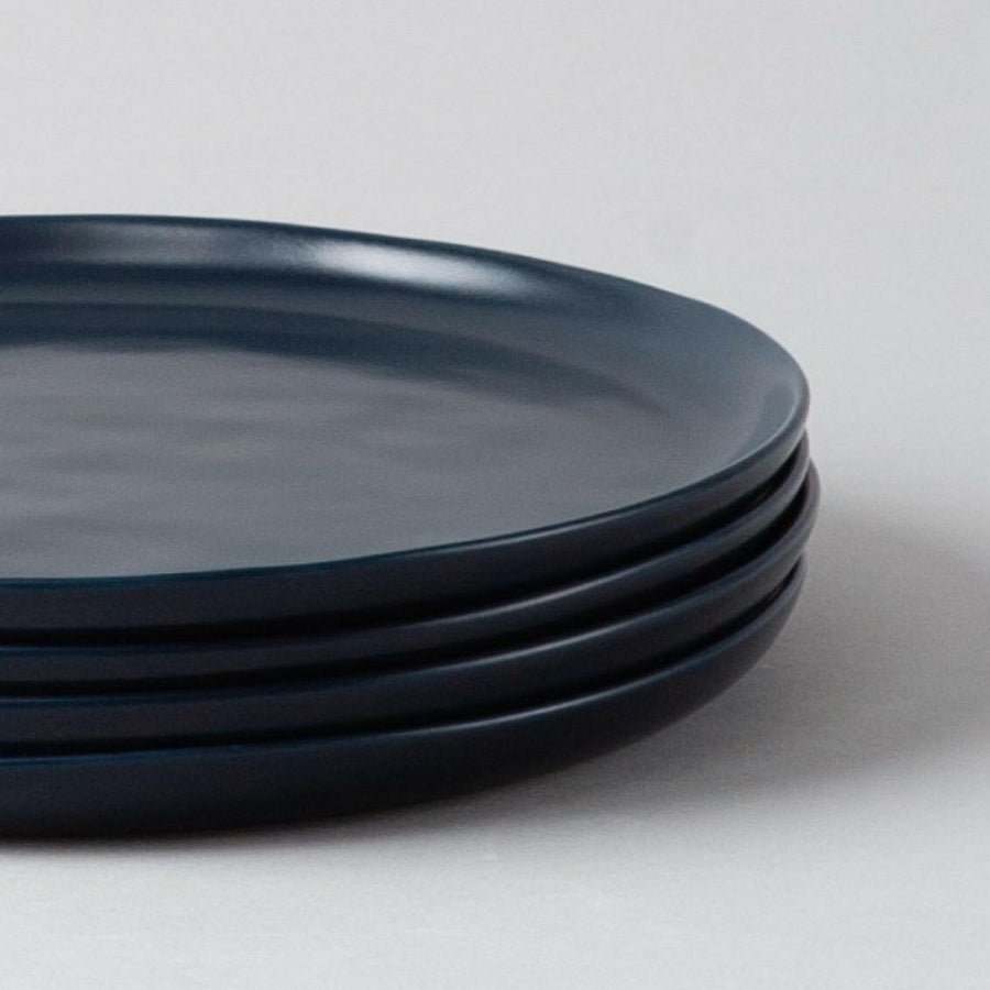 Fresh garden salad served on elegant plates, perfect for a healthy and stylish meal presentation.