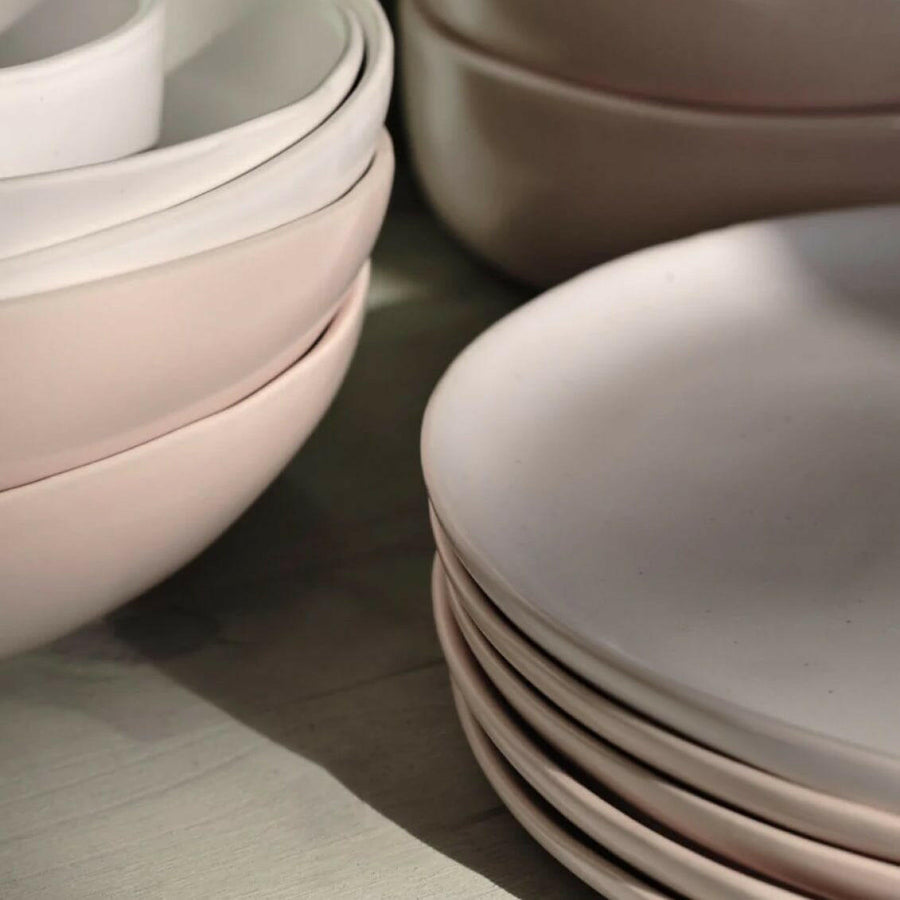 Fresh garden salad served on elegant plates, perfect for a healthy and stylish meal presentation.