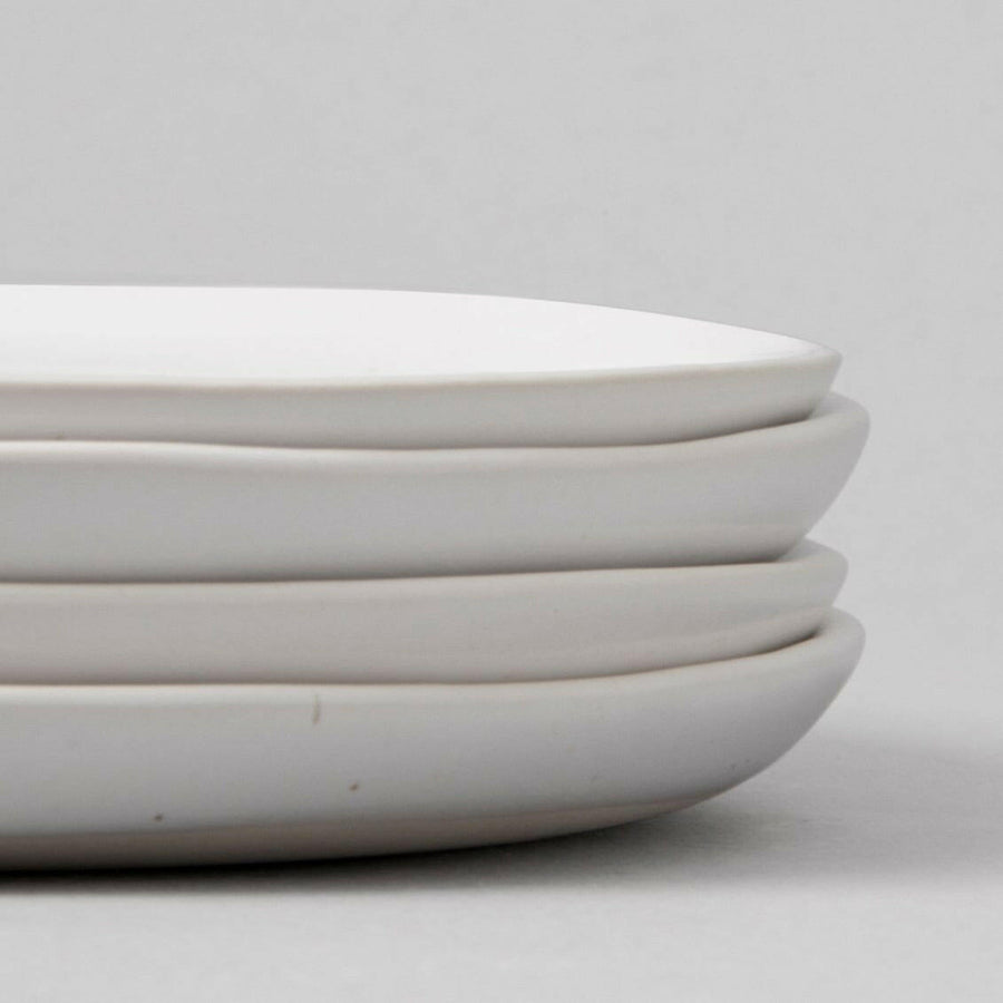 Fresh garden salad served on elegant plates, perfect for a healthy and stylish meal presentation.