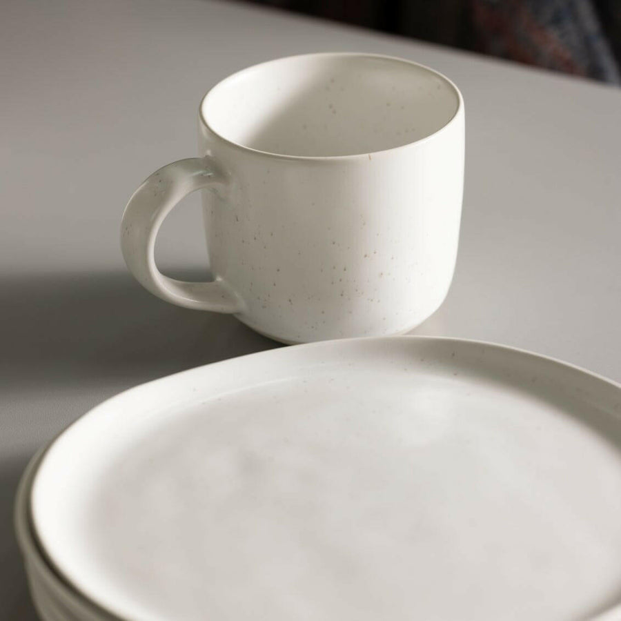 Fresh garden salad served on elegant plates, perfect for a healthy and stylish meal presentation.