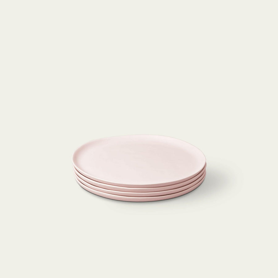 Fresh garden salad served on elegant plates, perfect for a healthy and stylish meal presentation.