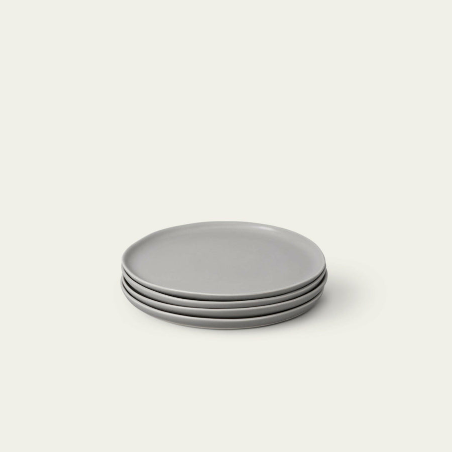 Fresh garden salad served on elegant plates, perfect for a healthy and stylish meal presentation.