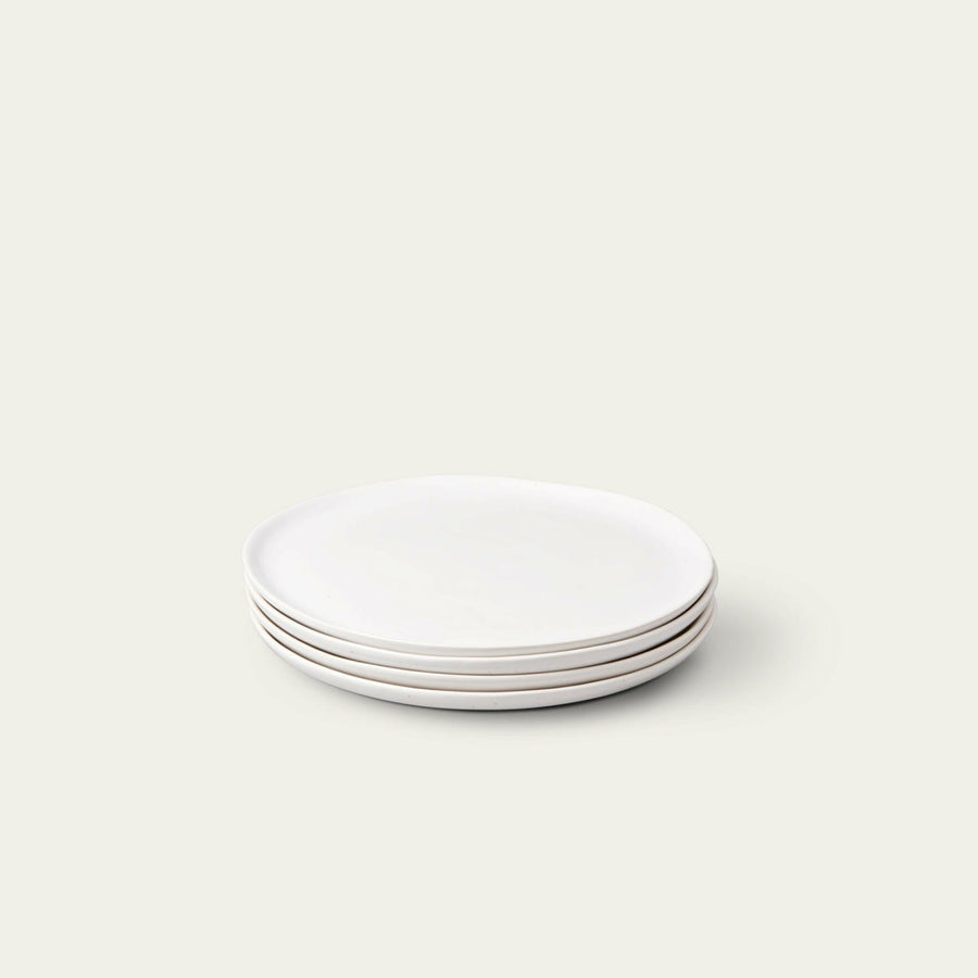 Fresh garden salad served on elegant plates, perfect for a healthy and stylish meal presentation.