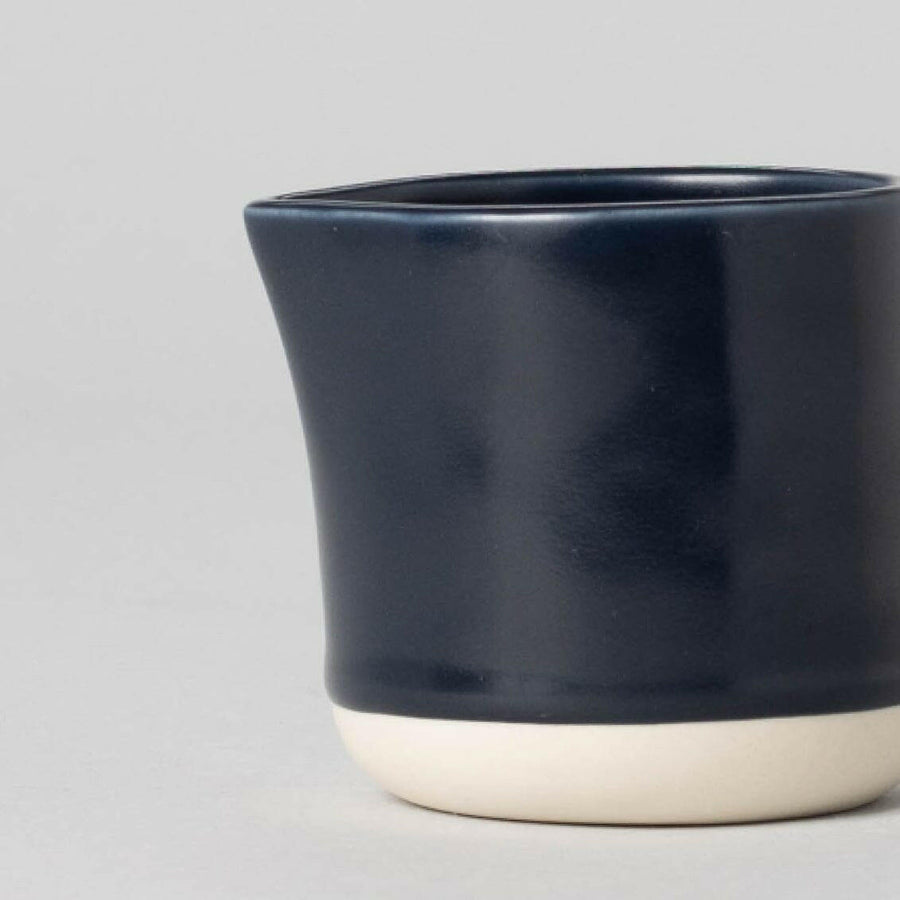 Elegant small carafe for serving beverages, perfect for home or office use enhancing presentation and convenience.